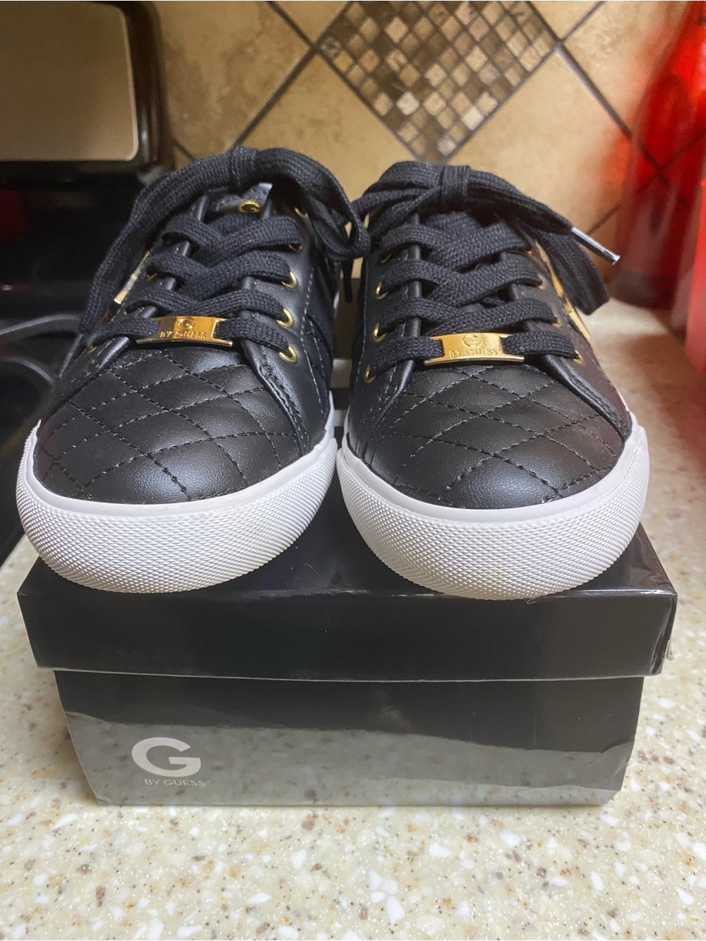 G by Guess Backer Black Quilted Sneakers with White Soles and Gold Accents